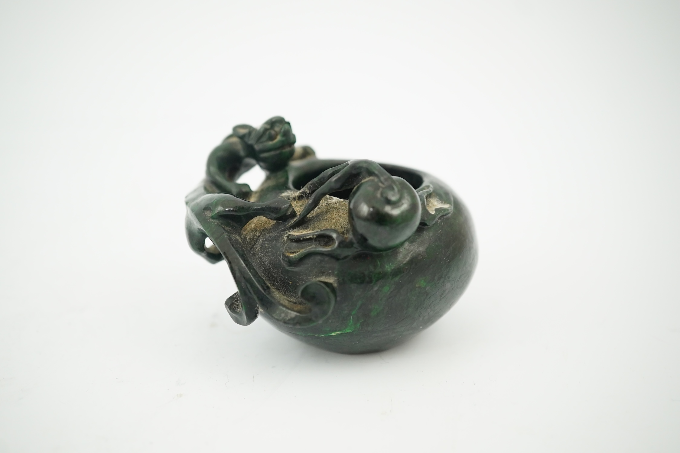 A Chinese dragon carved green hardstone brushwasher, 5cm high. Condition - good